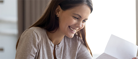 happy girl reading letter