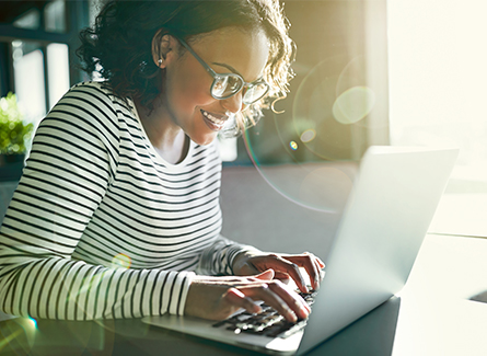 smiling girl on computer