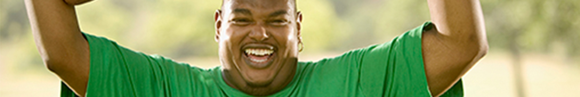 A man with his arms in the air cheering