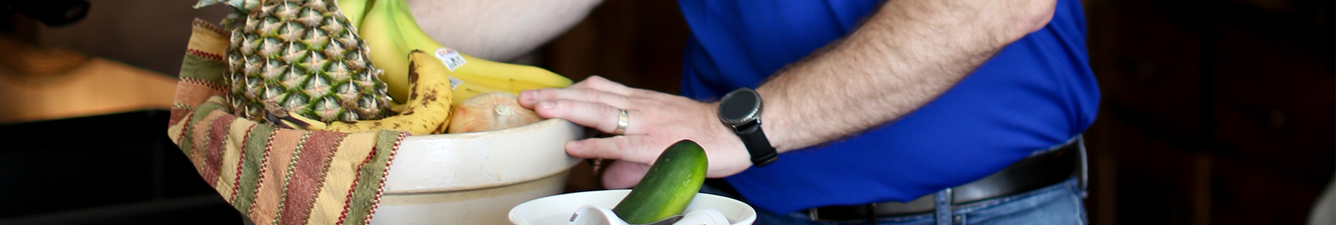A man with a bowl of fruit