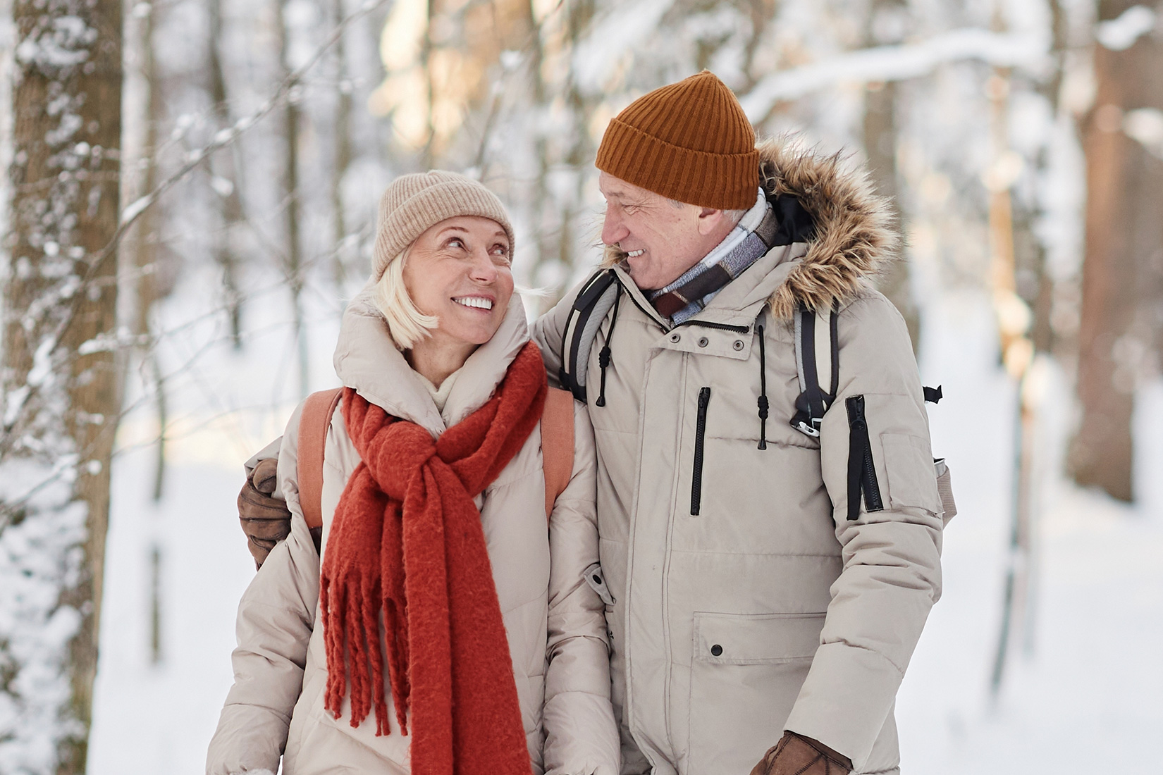 Older couple walking in snow