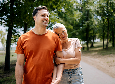 Happy couple walking in park