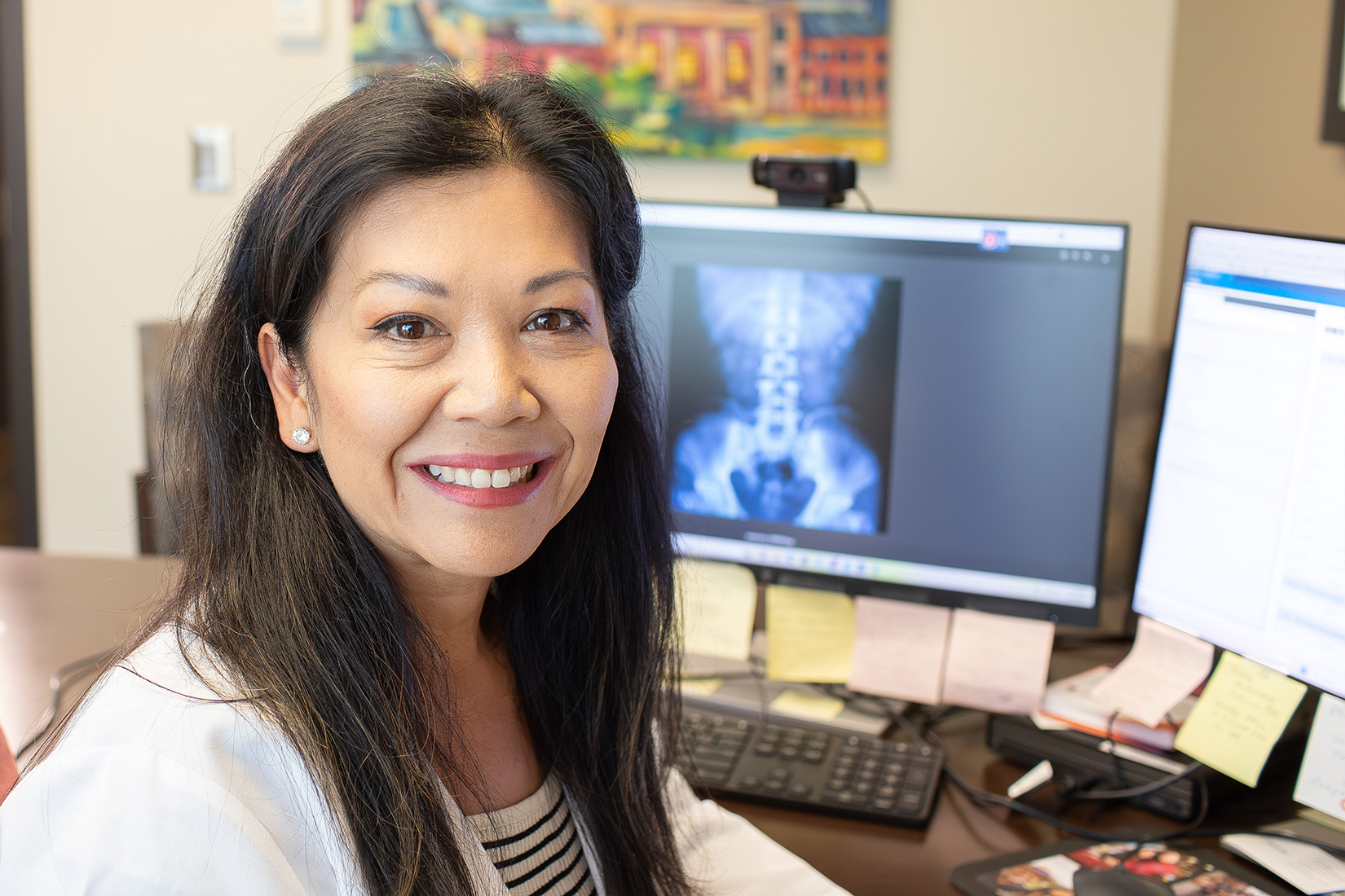 GI doctor with computer model on screen