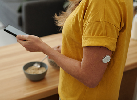 Woman with diabetes checking phone