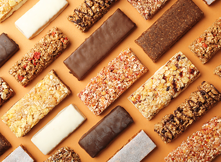 Unpackaged protein bars on an orange background