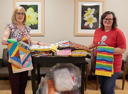 Teresa Harris and Susan Gass with Project Linus blankets