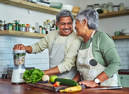 Older couple making healthy smoothie