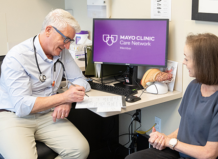 Doctor with patient going over results