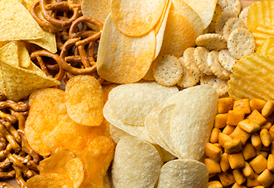 piles of potato chips, pretzels and crackers