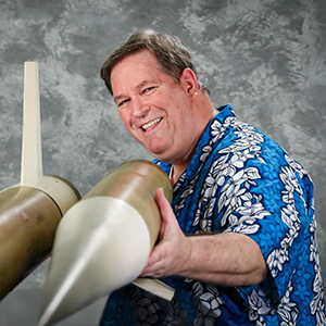 Terry Smemo holding a rocket